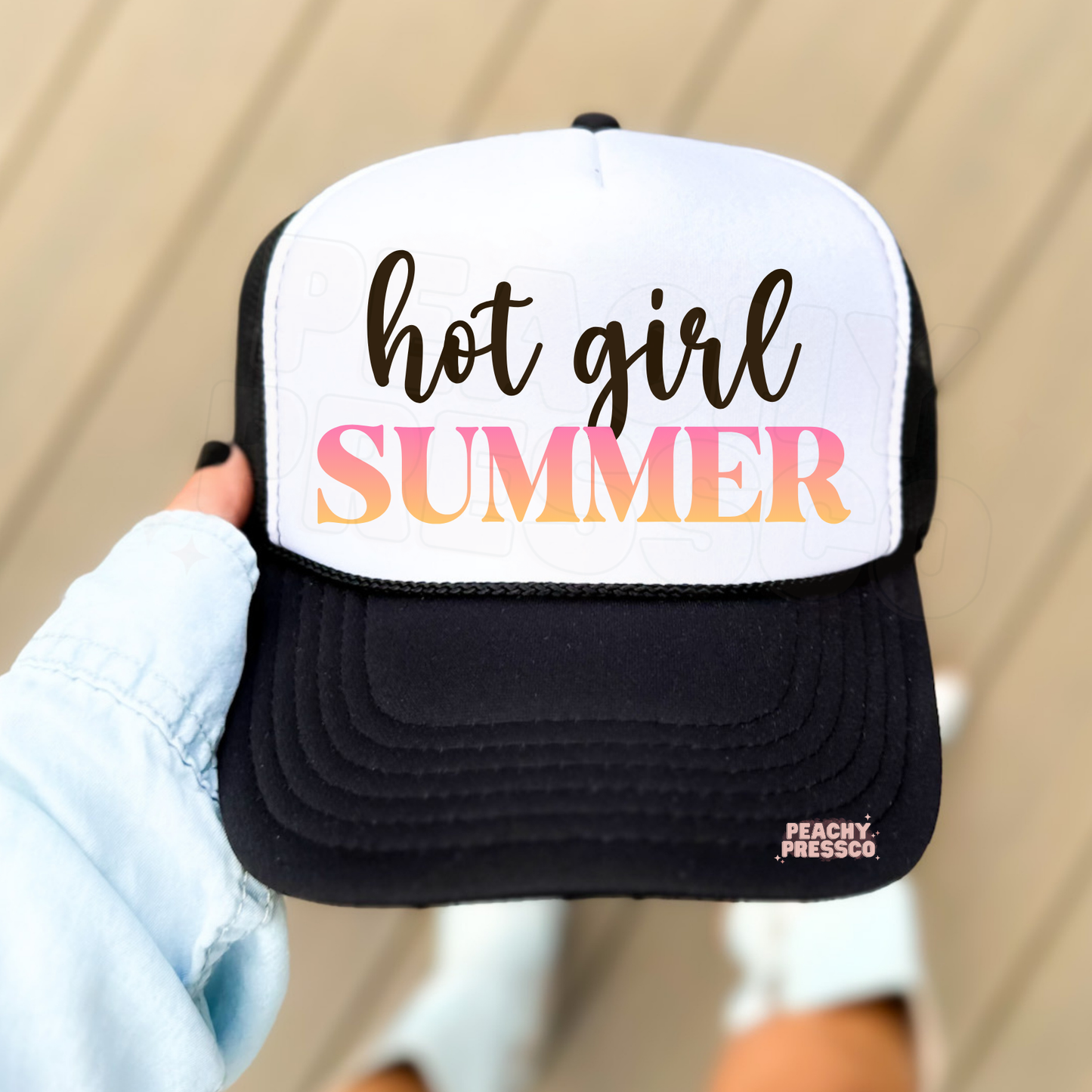 Black and white trucker hat with Hot Girl Summer text in gradient colors.