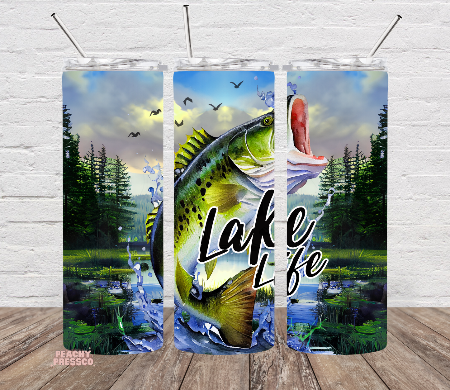 Stainless steel tumbler wrap featuring bass fish and lake landscape design.