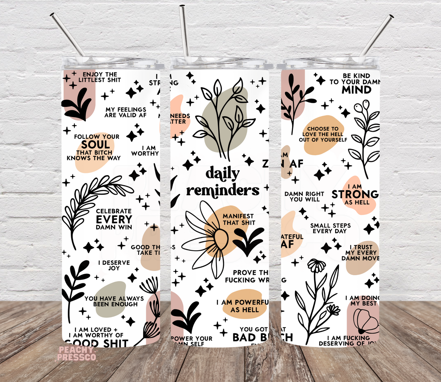 Daily Reminder affirmation tumbler featuring positive motivational quotes, floral illustrations, and a modern boho design on a 20oz skinny tumbler.