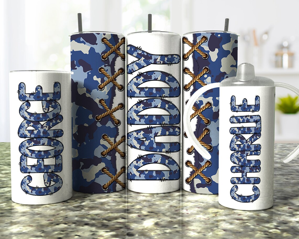 Matching personalized blue camouflage tumblers for dad and child featuring custom names and lace accents, perfect for Father's Day and family gifts.