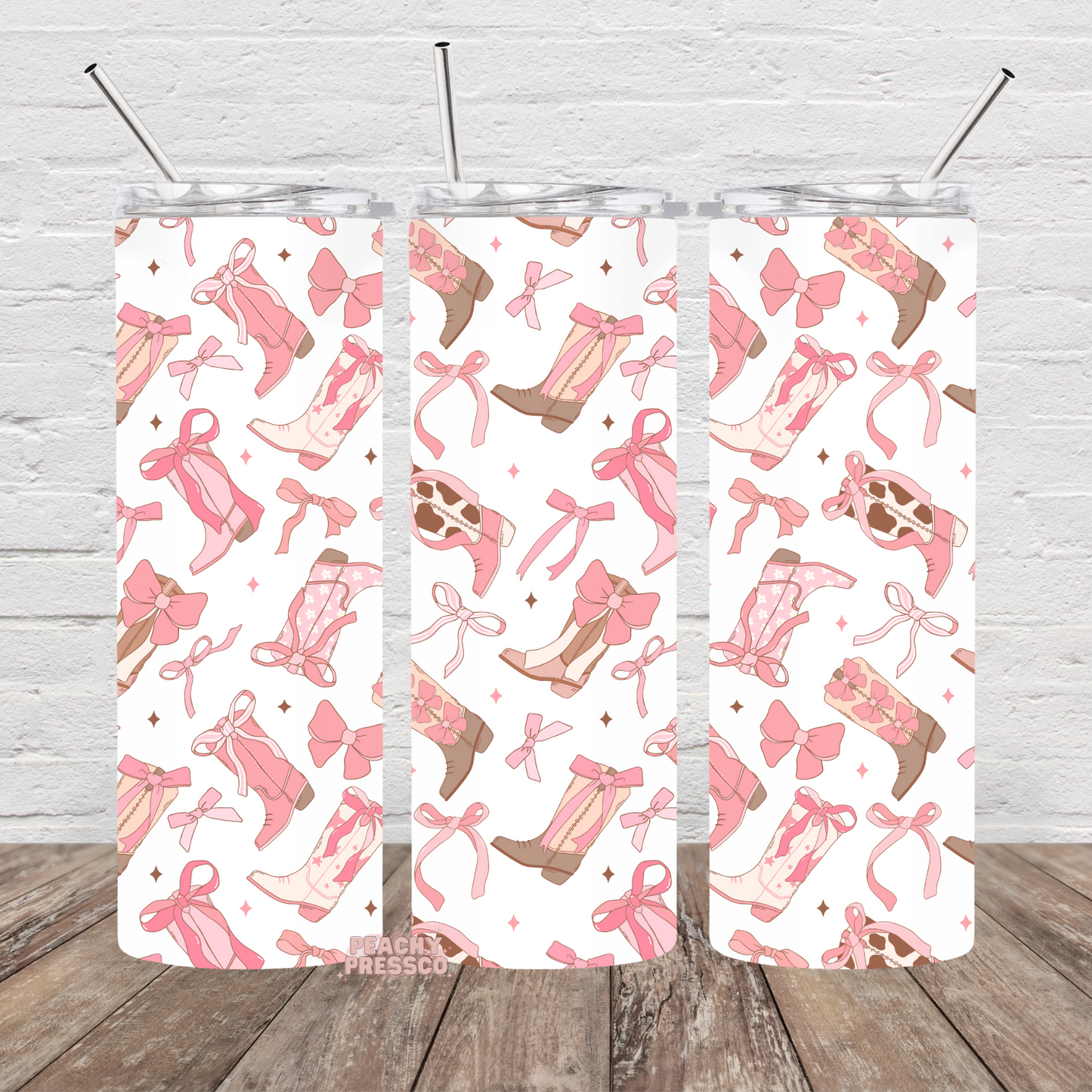 Girly Pink western tumbler featuring cowgirl boots, bows, ribbons, and feminine western pattern design.