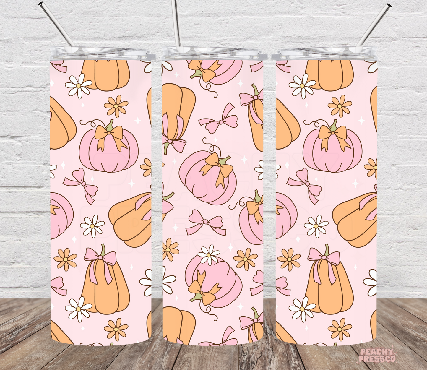 20oz skinny tumbler featuring a pink pumpkin pattern with bows, daisies, and pastel coquette fall design on a light pink background.