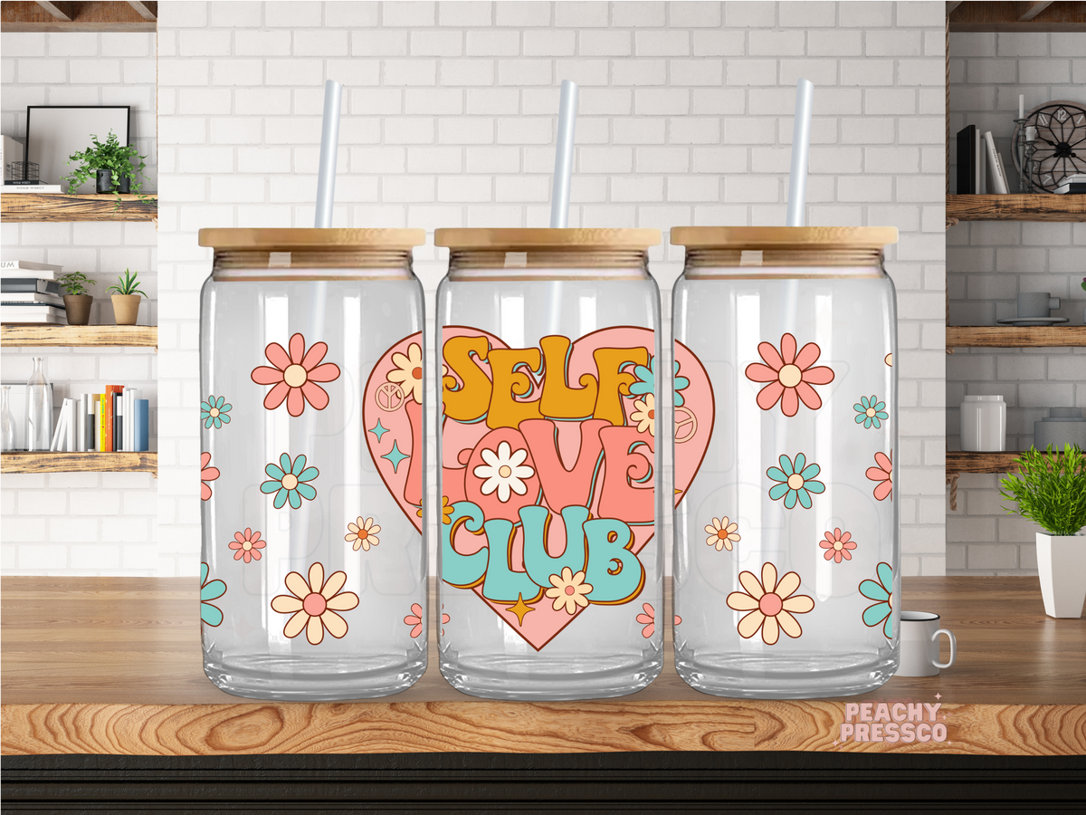 Self Love Club 16oz glass cup with bamboo lid and glass straw featuring retro flowers and pastel self-love design.
