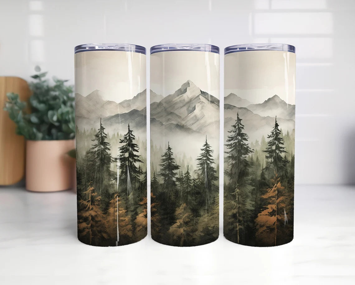 20oz tumbler with watercolor mountain landscape with evergreen forest and misty wilderness design.