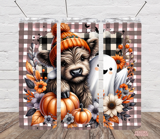 Decorative wall art with a dog, ghost, and pumpkins on a checkered background.