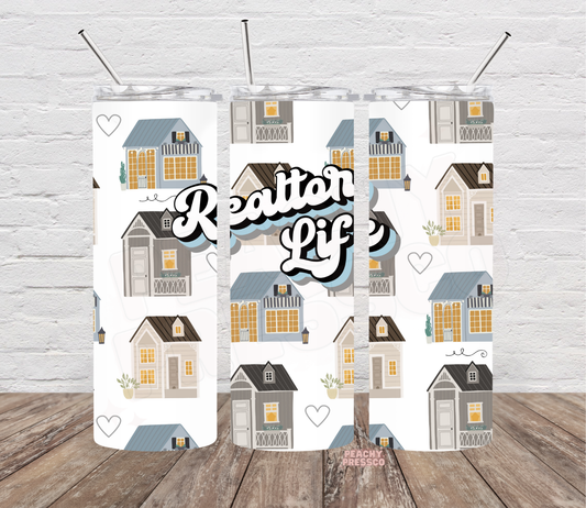 20 oz Realtor Life skinny tumbler with illustrated houses, blue and gray rooftops, warm yellow windows and bold real estate lettering.