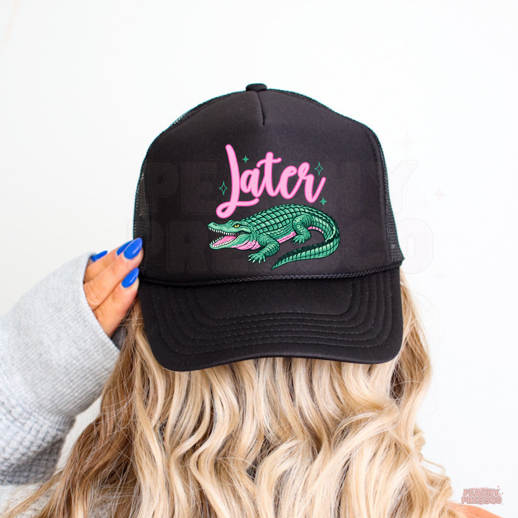 Black trucker hat with pink “Later” lettering and teal alligator design, perfect for summer vacations, lake life and casual everyday wear.