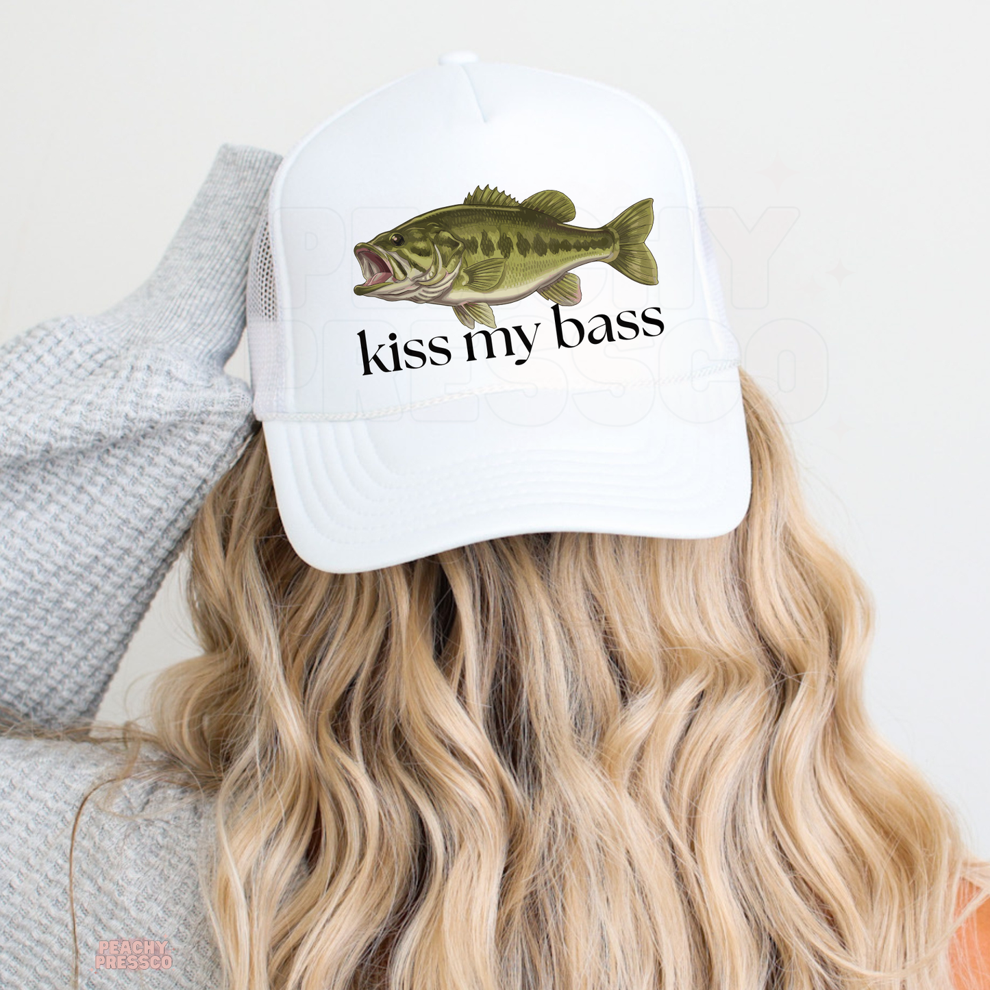 Women’s white fishing trucker hat with bass illustration and Kiss My Bass saying – cute lake life and outdoor summer accessory.