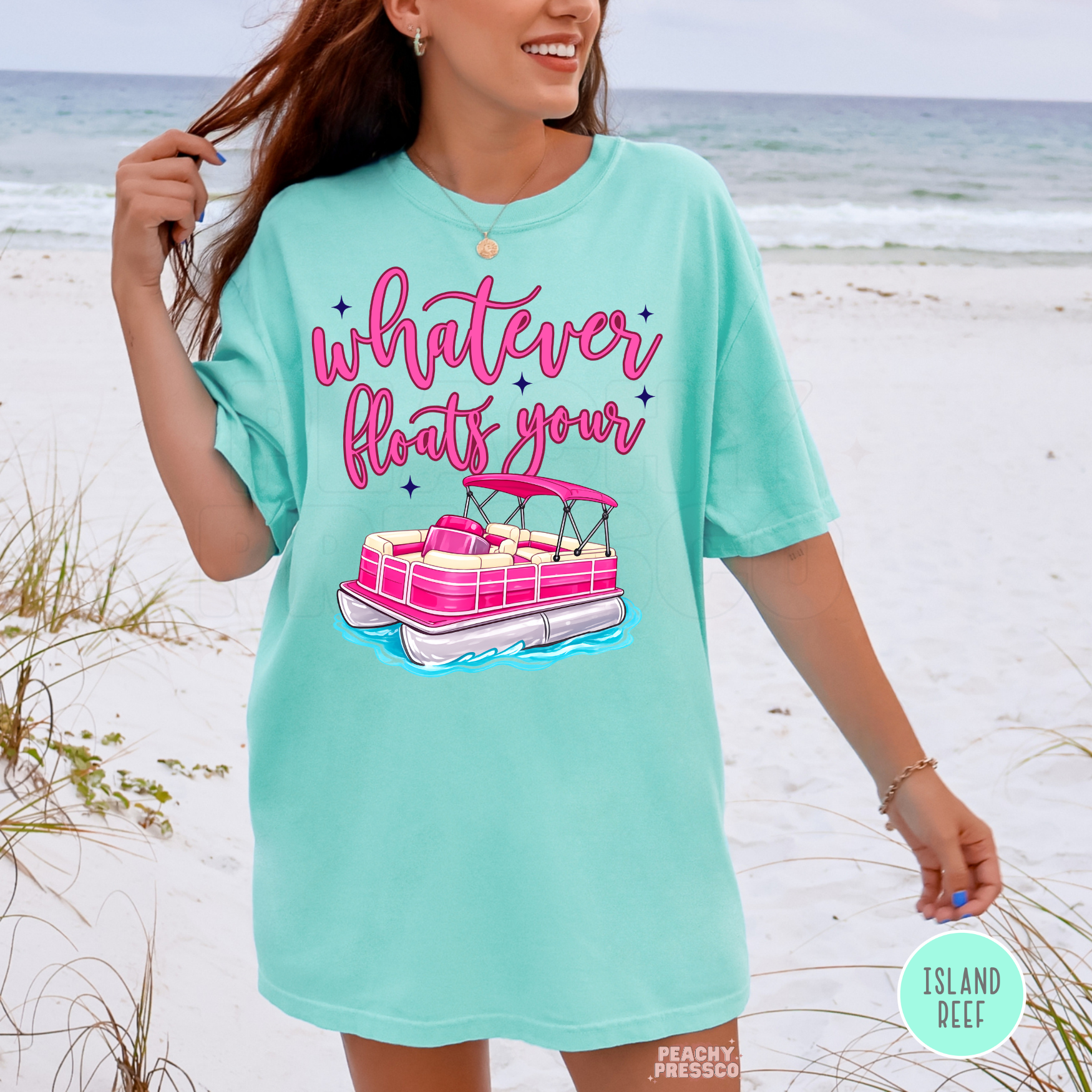 Island Reef oversized graphic t-shirt featuring pink pontoon boat and “Whatever Floats Your” design – cute lake life and summer vacation shirt for women.