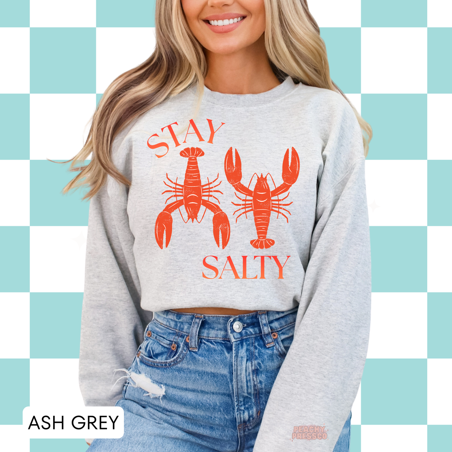 Ash grey crewneck sweatshirt with retro lobster illustration and “Stay Salty” graphic – relaxed coastal style sweatshirt for women.