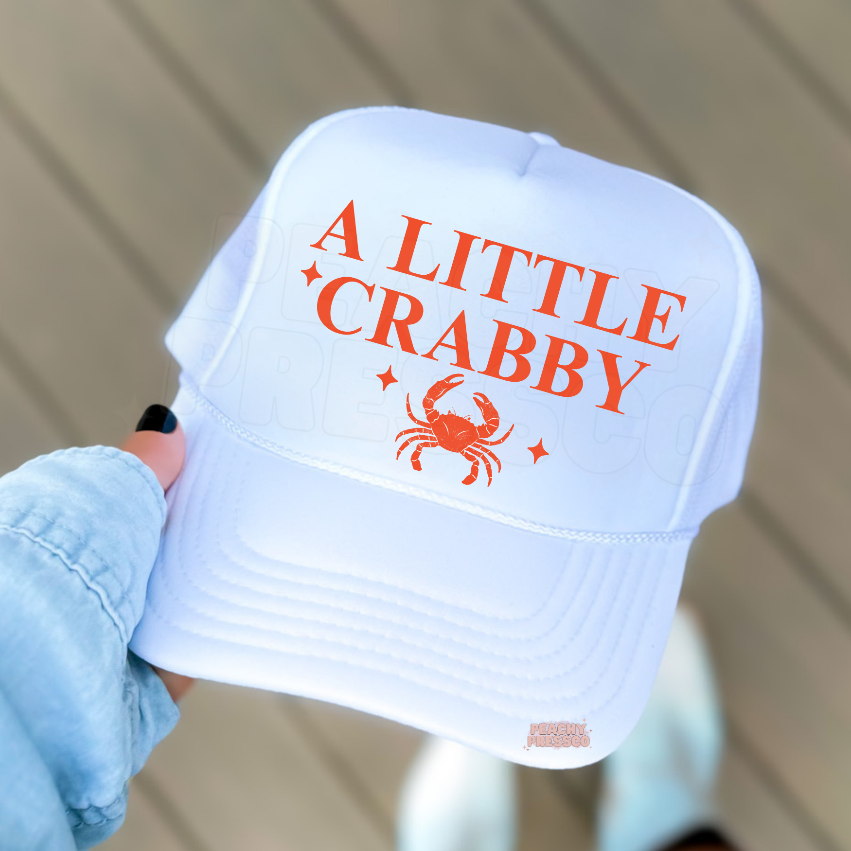 Cute A Little Crabby trucker hat with crab artwork and bold lettering – lightweight summer accessory for beach days and lake weekends.