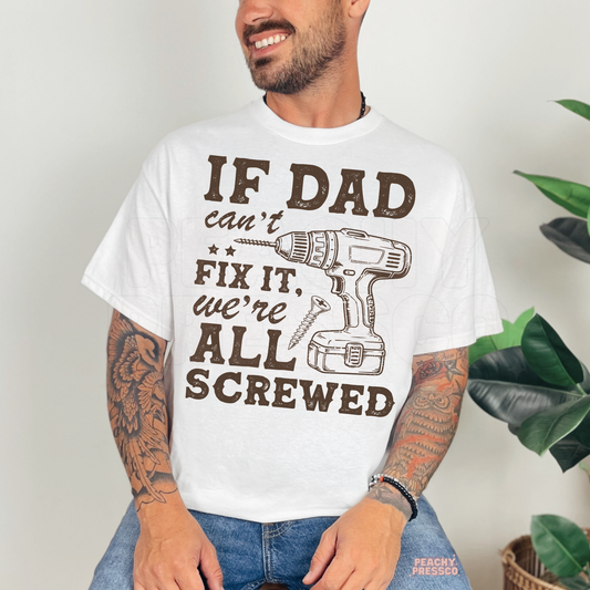 Man wearing white t-shirt with drill graphic and “If Dad Can’t Fix It We’re All Screwed” quote.