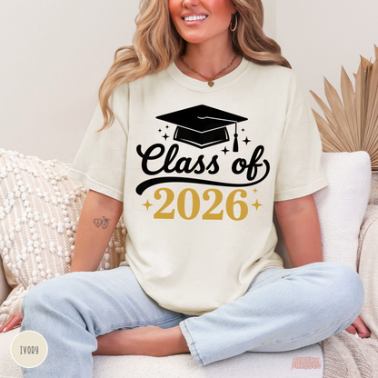 Class of 2026 graduate t-shirt in ivory with graduation cap design and gold accents, perfect gift and graduation outfit.