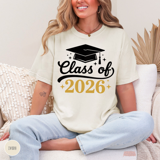 Class of 2026 graduate t-shirt in ivory with graduation cap design and gold accents, perfect gift and graduation outfit.