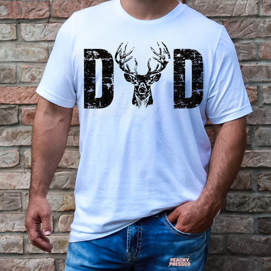 Man wearing white t-shirt with distressed deer graphic forming the word “Dad.”
