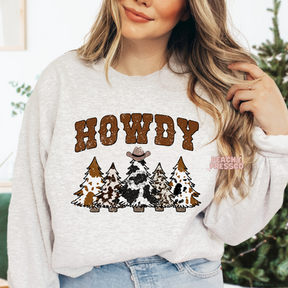 Howdy Holidays Cowboy Christmas Hoodie – Rustic Charm with Cowprint Trees Apparel