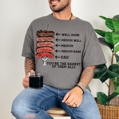 Smiling man modeling charcoal grey t-shirt featuring steak temperature chart and humorous dad grilling graphic print.