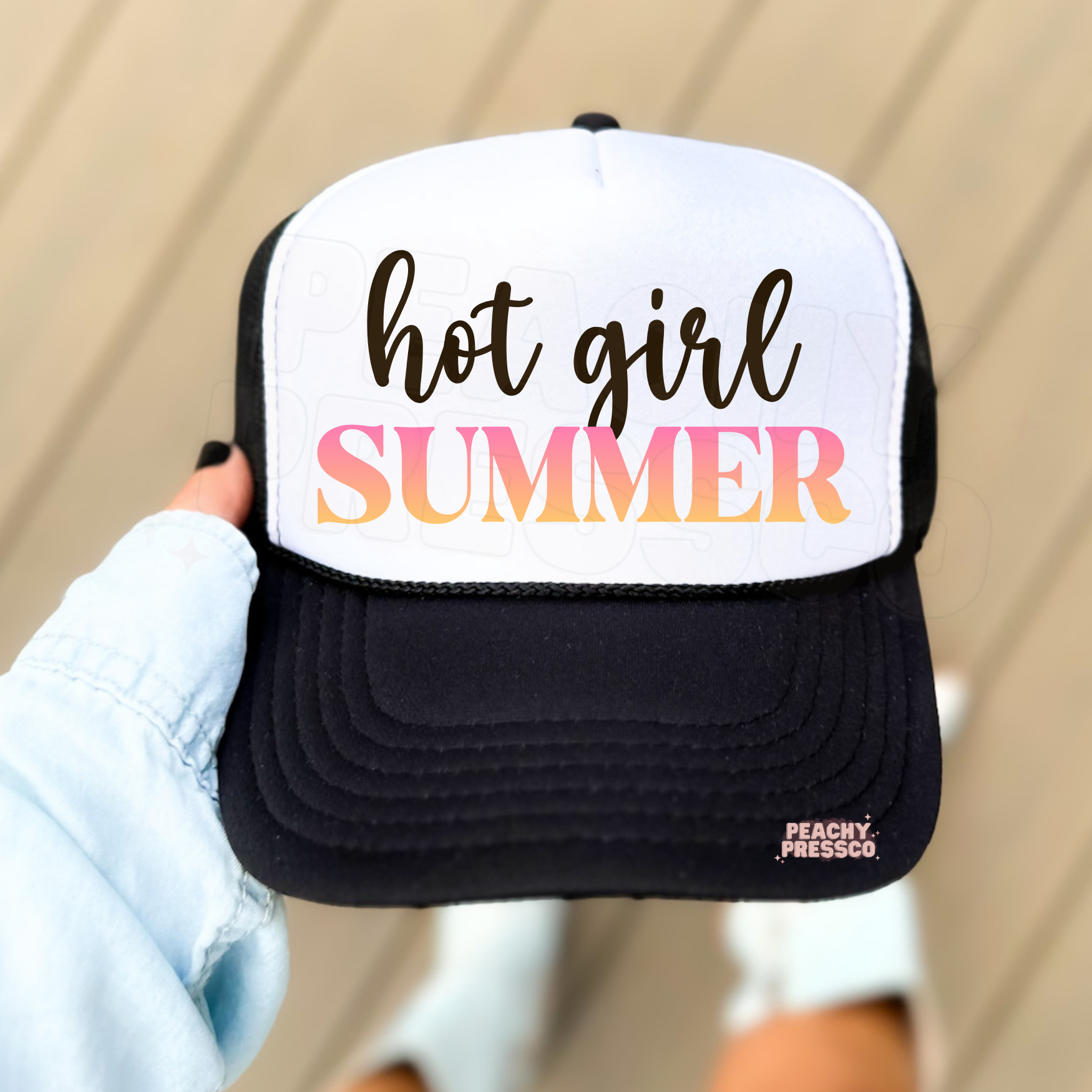 Black and white trucker hat with Hot Girl Summer text in gradient colors.