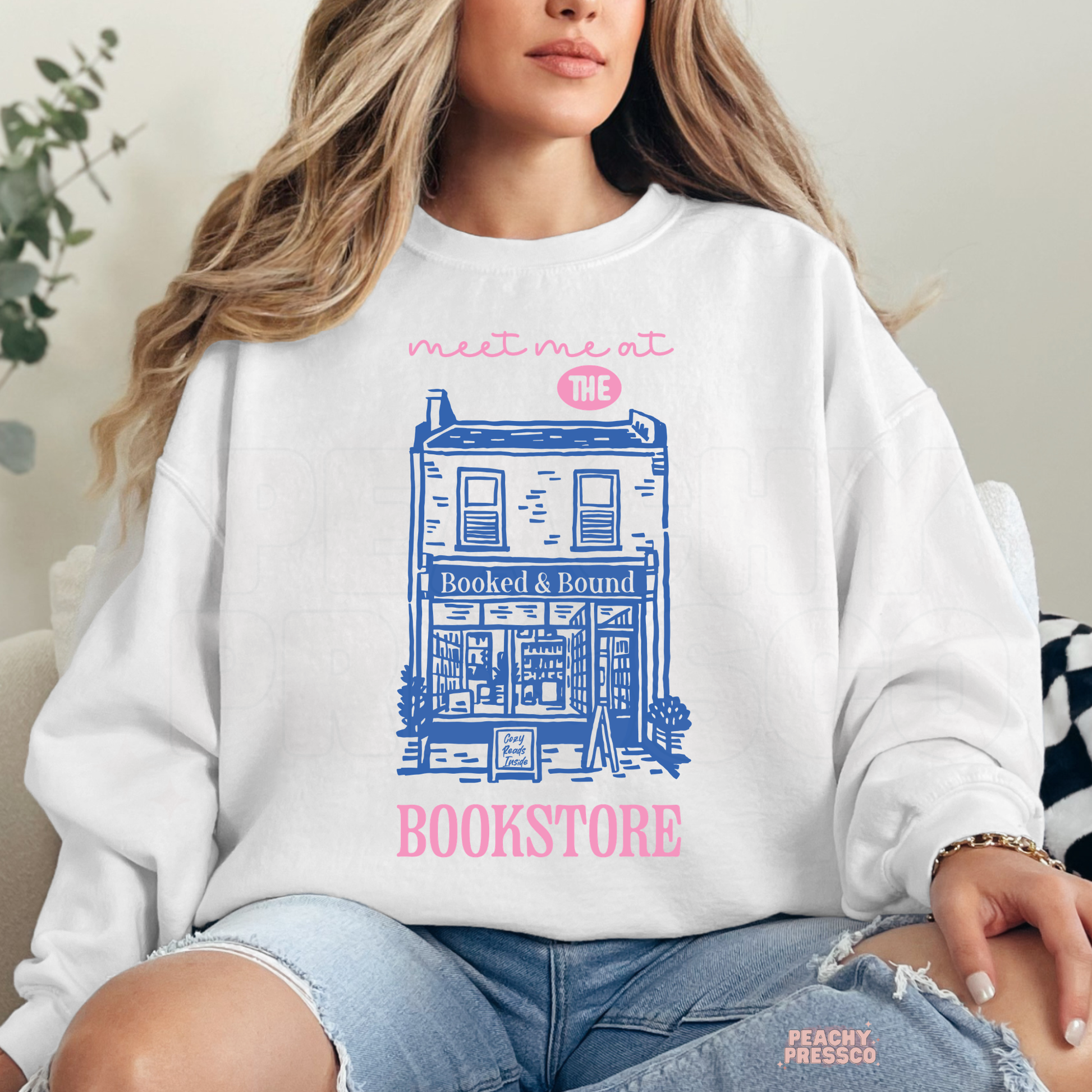 Meet me at the bookstore graphic sweatshirt in white with cute bookstore illustration for book lovers