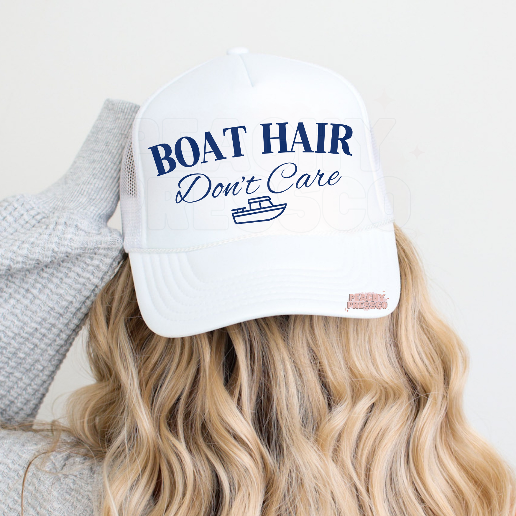 Women’s white trucker hat featuring Boat Hair Don’t Care design for lake life, boating trips and summer outfits.