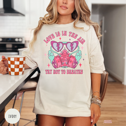 Love Is In The Air Try Not To Breathe Shirt | Funny Valentine's Day Graphic Tee | Retro Coquette Pink Respirator Sweatshirt | Cute Sarcastic Gift