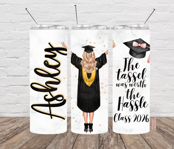 Personalized Class of 2026 graduation tumbler featuring graduate illustration, custom name and "The Tassel Was Worth The Hassle" graduation quote.