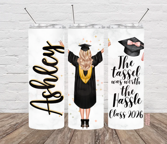 Personalized Class of 2026 graduation tumbler featuring graduate illustration, custom name and "The Tassel Was Worth The Hassle" graduation quote.