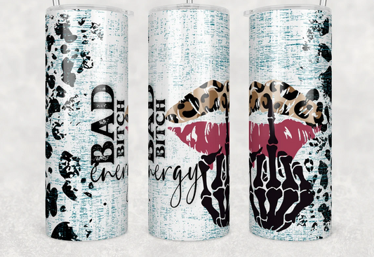 Skinny tumbler featuring leopard print lips, a skeleton hand, distressed turquoise background, and the phrase "Bad Energy Bitch."