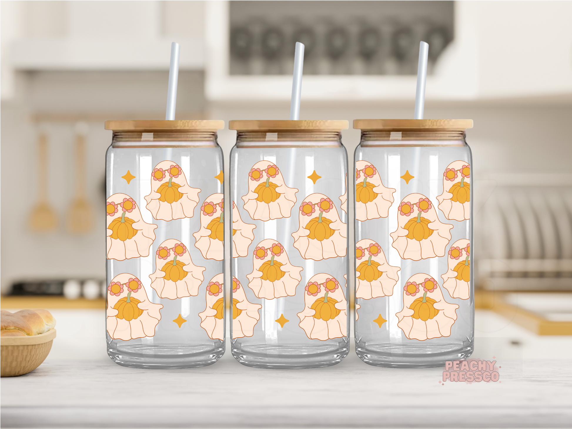 16oz glass cup featuring adorable boho ghosts holding pumpkins with daisy flower crowns in a cute autumn pattern.