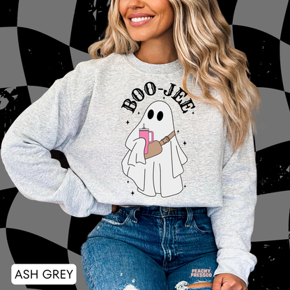 Woman wearing an ash grey Boo-Jee ghost Halloween crewneck sweatshirt with trendy spooky ghost design.