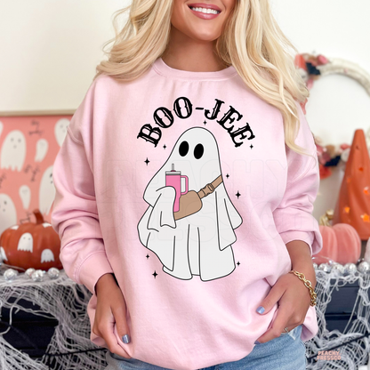 Woman wearing a light pink Boo-Jee ghost Halloween crewneck sweatshirt with cute ghost holding a tumbler.