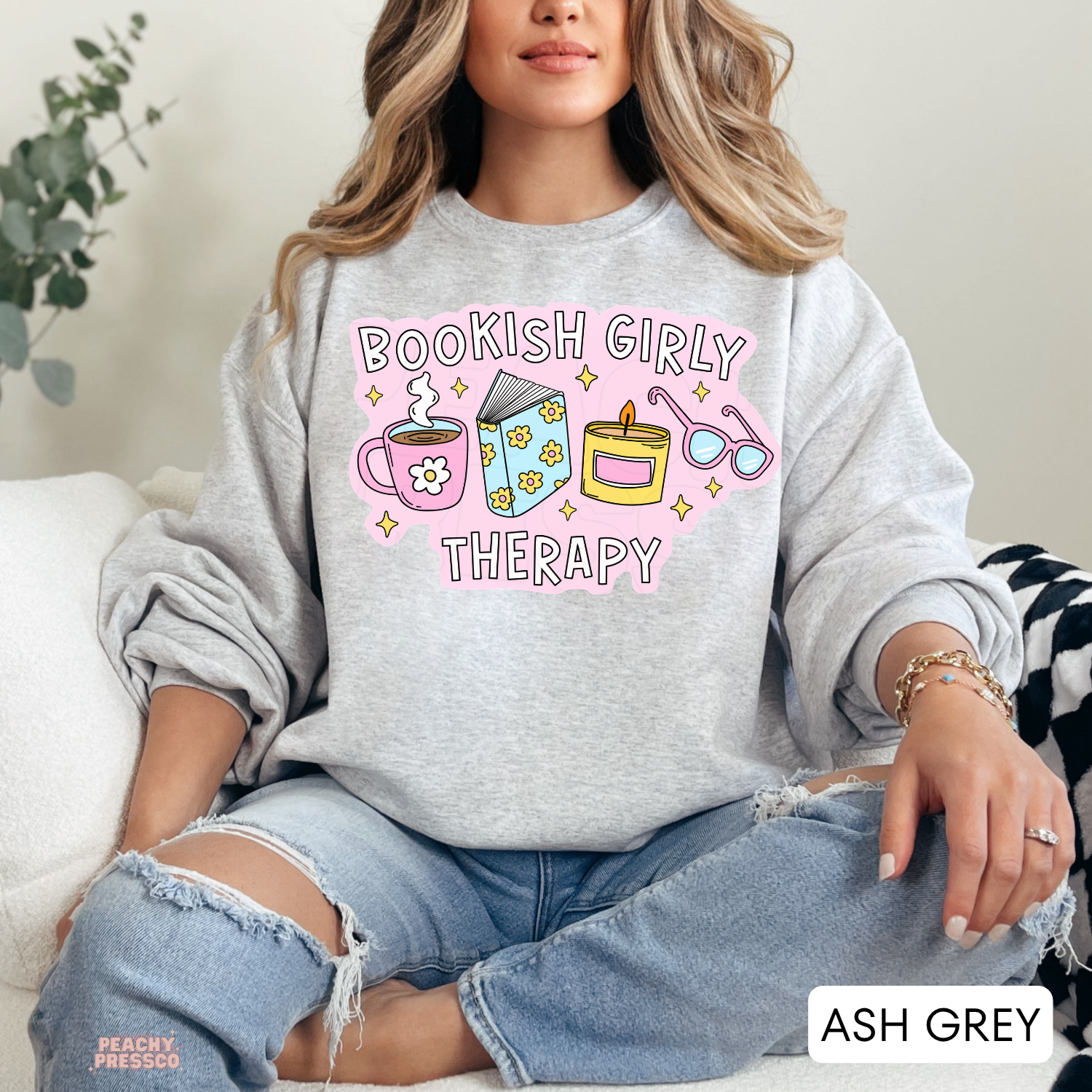 Ash Grey crewneck sweatshirt with Bookish Girly Therapy design featuring coffee, book, candle, and reading glasses.