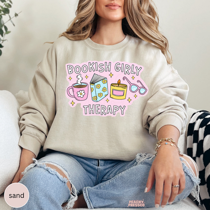 Sand crewneck sweatshirt with cute Bookish Girly Therapy design for readers, bookworms, and coffee lovers.