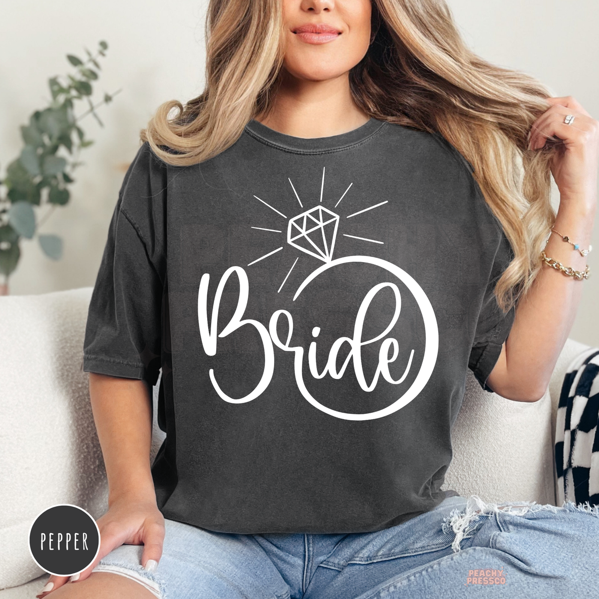 Pepper Comfort Colors t-shirt featuring a minimalist "Bride" graphic designed as a diamond engagement ring in white, perfect for bridal showers, bachelorette parties, and wedding celebrations.