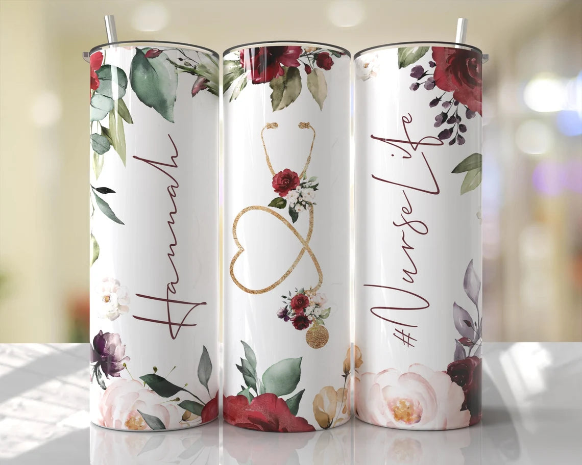 Elegant 20oz nurse tumbler featuring burgundy floral accents, gold stethoscope heart, and nurse script design with reusable straw.