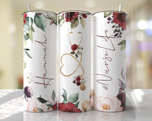 Elegant 20oz nurse tumbler featuring burgundy floral accents, gold stethoscope heart, and nurse script design with reusable straw.