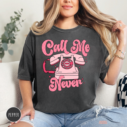 Call Me Never retro pink telephone graphic printed on a pepper Comfort Colors t-shirt with a vintage-inspired coquette design.