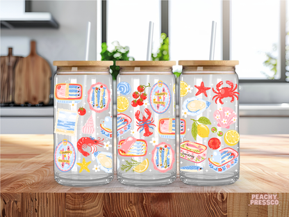 Coastal seafood glass cup featuring sardines, crab, lobster, oysters and lemon illustrations with bamboo lid and straw.
