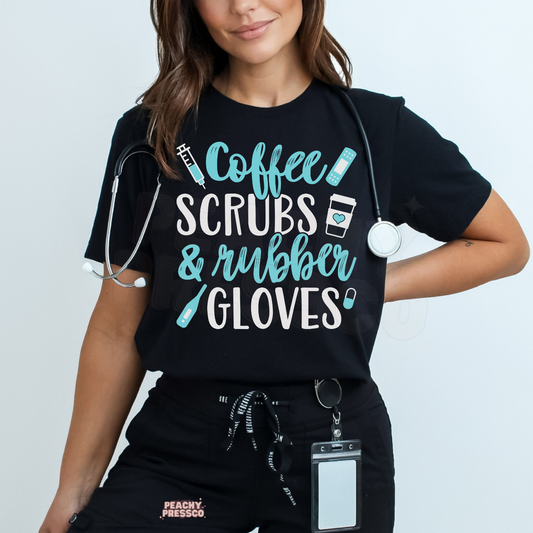 Healthcare worker wearing a black Coffee Scrubs & Rubber Gloves graphic T-shirt with turquoise and white lettering and a stethoscope.