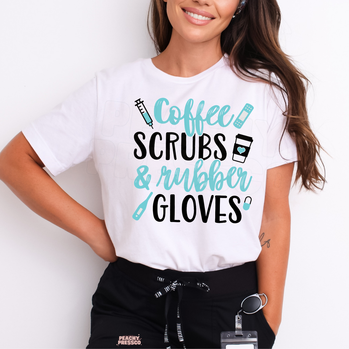 Woman wearing a white Coffee Scrubs & Rubber Gloves T-shirt with turquoise and black lettering, syringe, bandage and coffee cup icons.