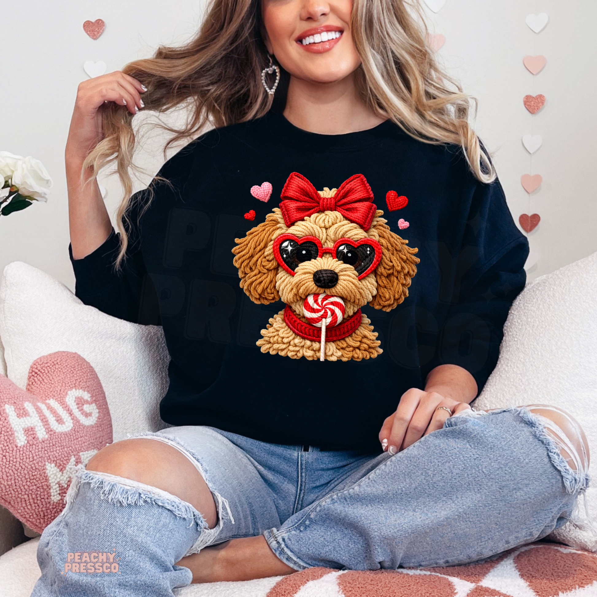 Black crewneck sweatshirt displaying a playful Valentine's puppy wearing heart-shaped sunglasses, a red bow, and surrounded by hearts.