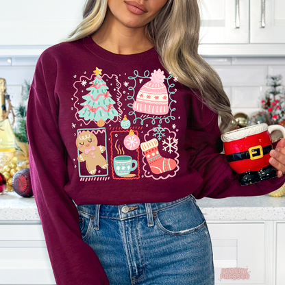 A woman wearing a maroon crewneck sweatshirt with a colorful Christmas-themed graphic print, paired with blue jeans and holding a Santa-themed mug in a kitchen setting.