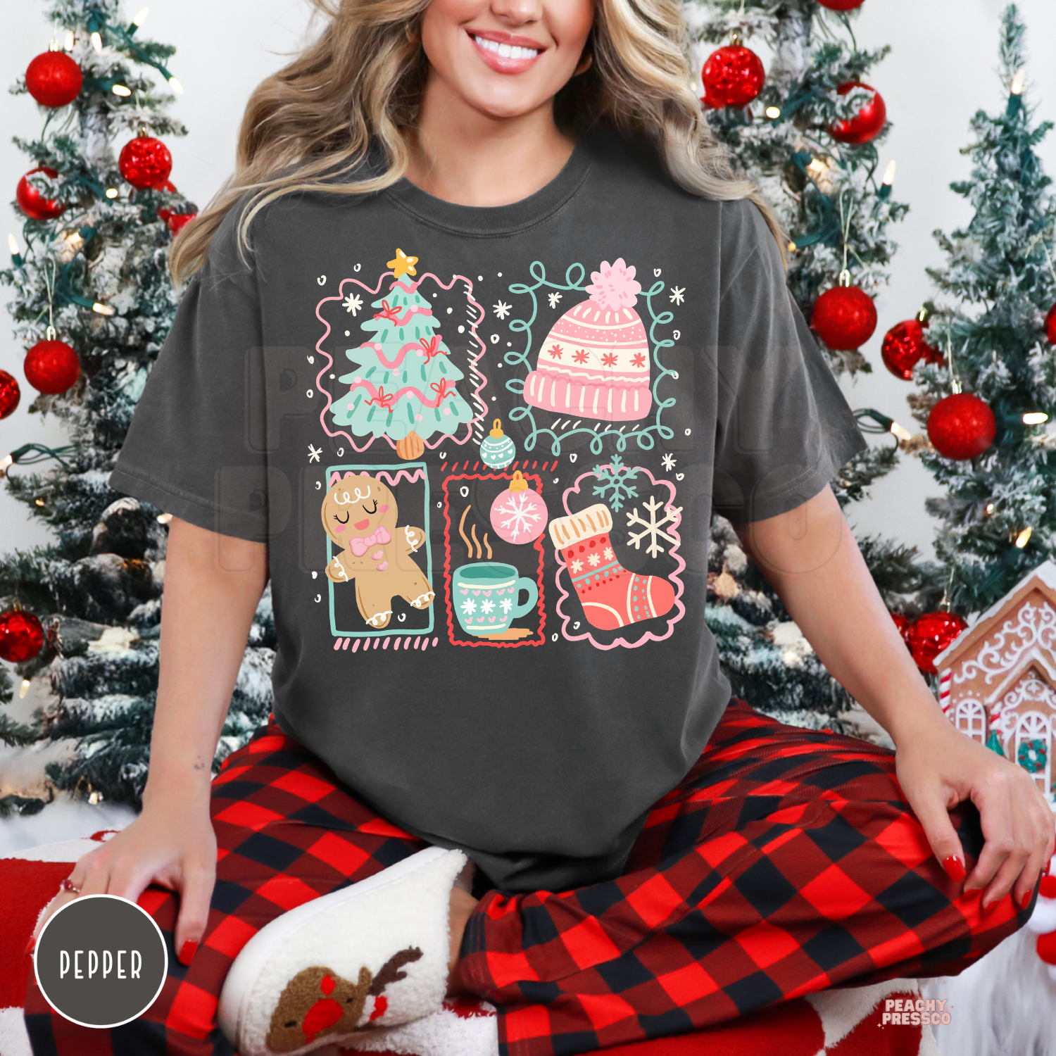Women wearing a vintage pepper grey oversized Christmas t-shirt paired with red buffalo plaid pajama pants, sitting in front of holiday trees.