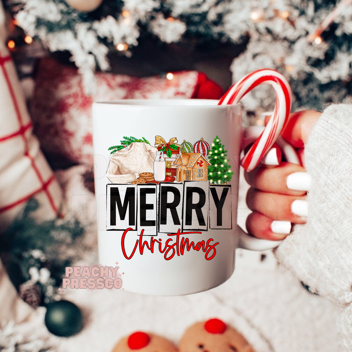 White mug featuring Merry Christmas text with cozy cable knit sweater, gingerbread house, milk, and Christmas tree graphics.