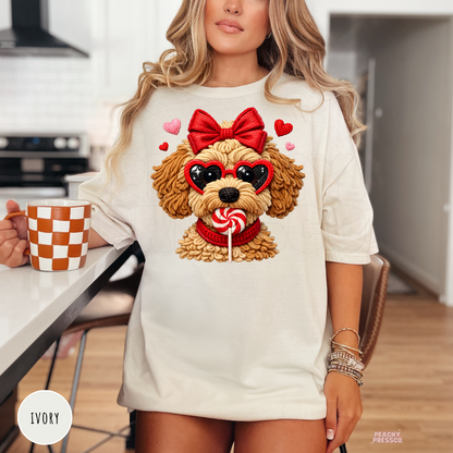 Ivory oversized Valentine's Day t-shirt with an adorable puppy graphic wearing a red bow, heart sunglasses, and surrounded by hearts.