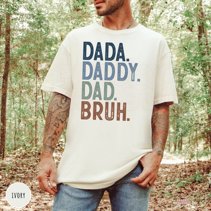 Ivory Comfort Colors t-shirt with the humorous "Dada. Daddy. Dad. Bruh." design, perfect for Father's Day, birthdays, and everyday dad life.