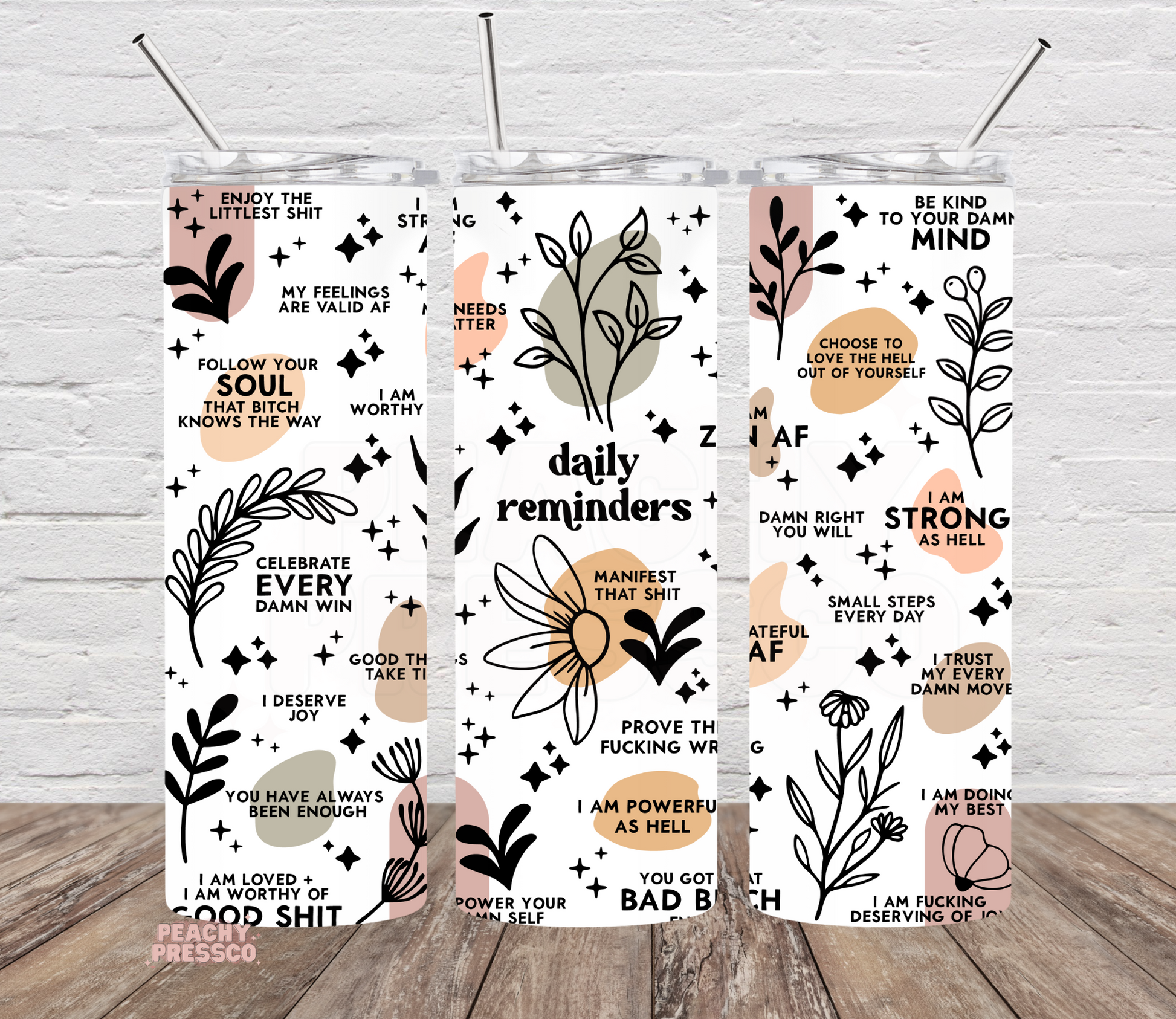 Daily Reminder affirmation tumbler featuring positive motivational quotes, floral illustrations, and a modern boho design on a 20oz skinny tumbler.