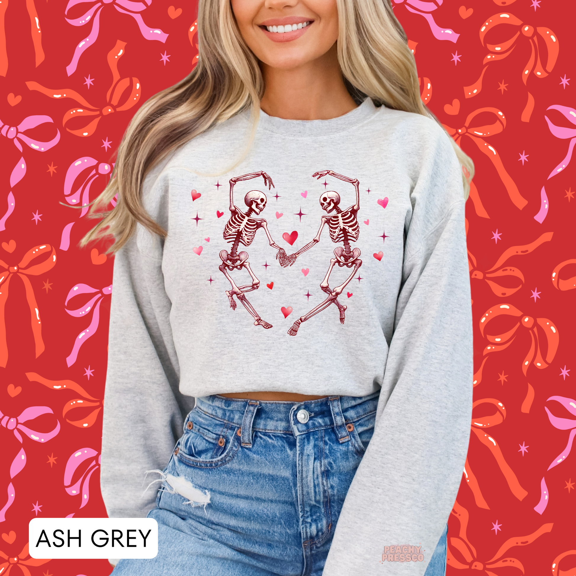 Ash grey crewneck sweatshirt with a vintage-inspired dancing skeleton heart graphic, perfect for spooky Valentine's Day style.