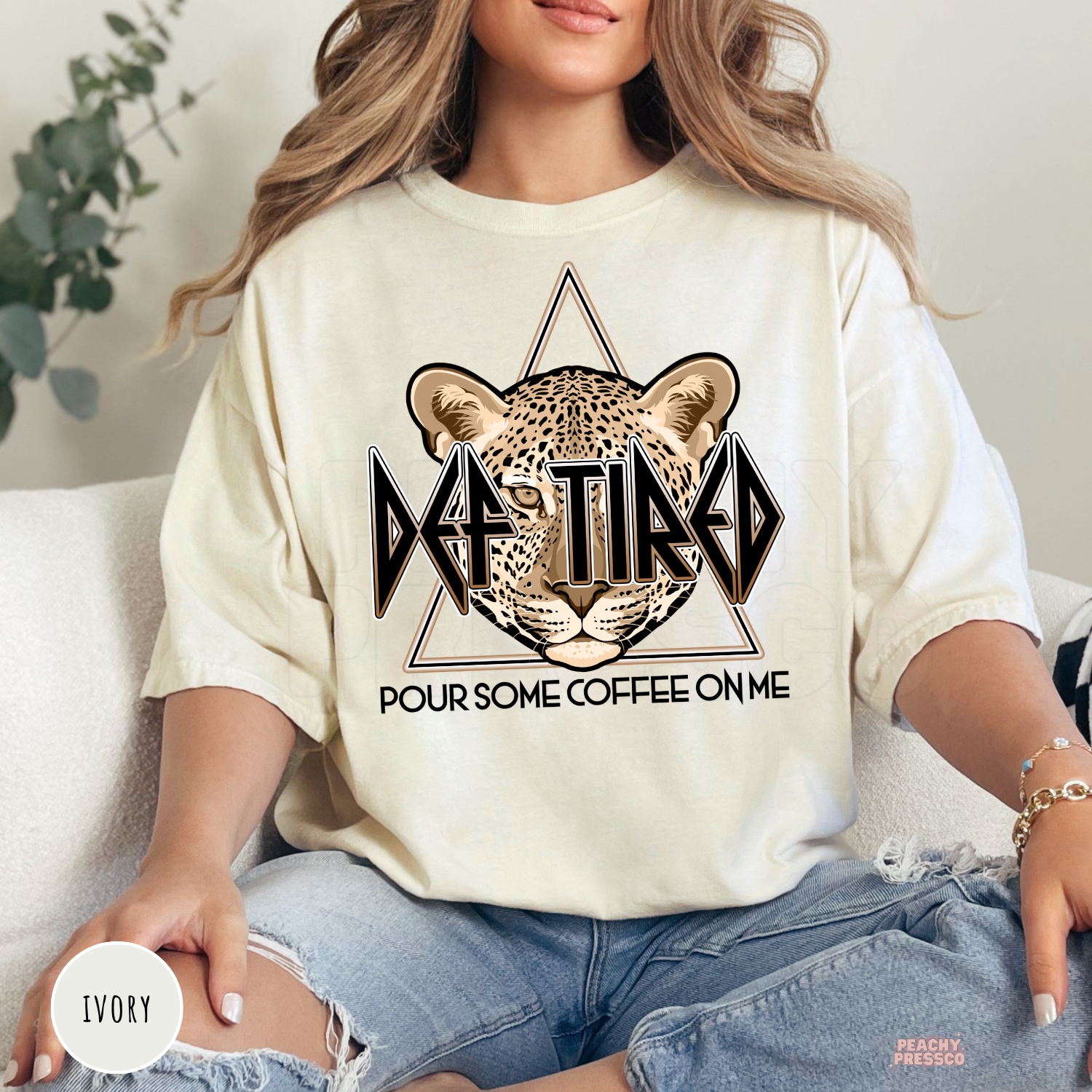 Ivory Def Tired Pour Some Coffee On Me graphic shirt with a leopard illustration and vintage coffee lover graphic.