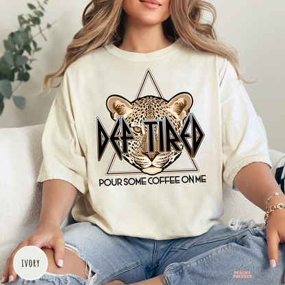 Ivory Def Tired Pour Some Coffee On Me graphic shirt with a leopard illustration and vintage coffee lover graphic.